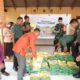 Dandim 1314/Gorut Bagikan Beras dan Bendera di Gerakan Pangan Murah Sumalata. (Foto: Kodim 1314/Gorut)