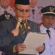 Ketua Komisi I DPRD Gorontalo Utara, Robinson Puluhulawa saat membacakan teks proklamasi. (Foto: Humas Kecamatan Gentuma)